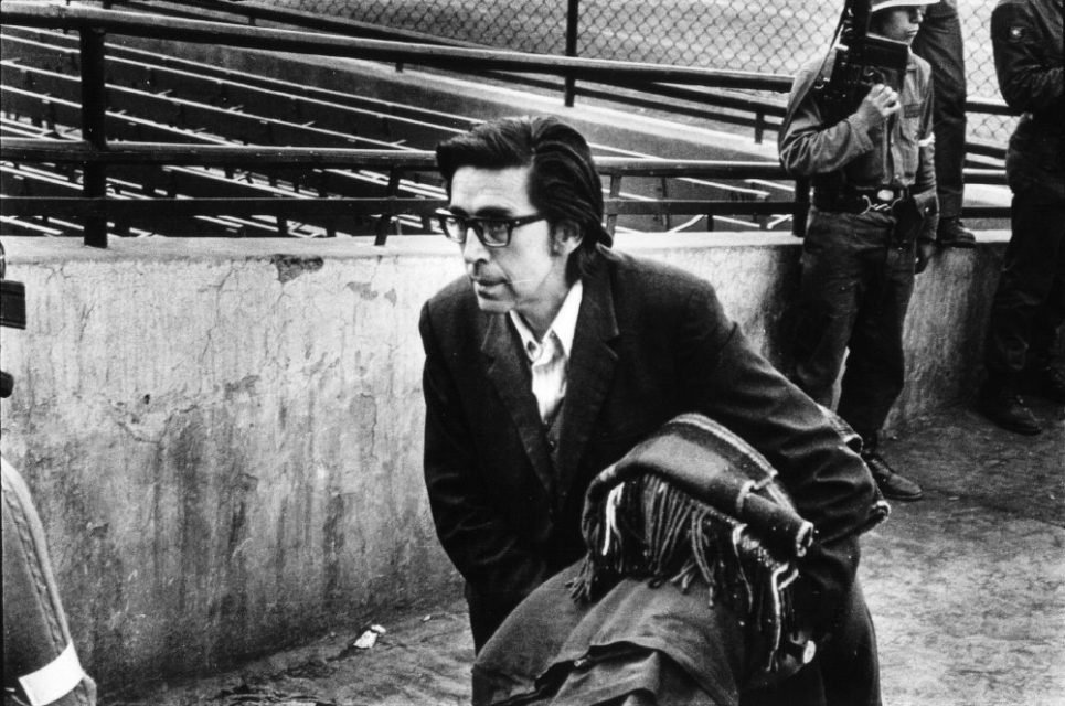 Chili, Santiago, september 1973.
Several days after the military coup. Arrested man (most likely a teacher from university), enters the football stadion where many people were kept as  prisoners.