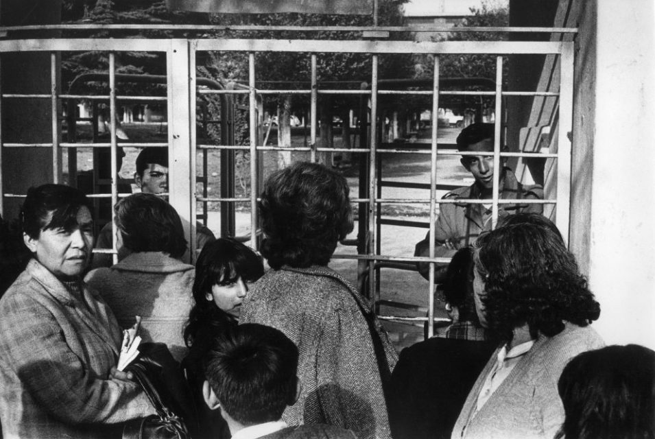 Chili, Santiago, september 1973. Several days after the military coup. People gather at the sheds where friends and family members are being held, trying to get some information.
