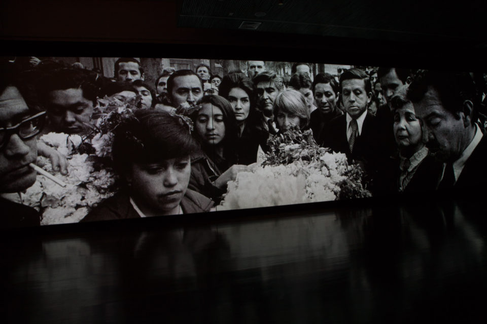 Three-screen projection showing the events around the military coup in 1973 as an audiovisual arrangement.
