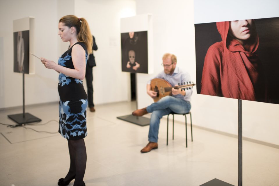 Sarah Akili Zegers and Gharib performing the excerpts from the 
Mini Opera - A Postcard from Aleppo 
at 
the exhibition opening