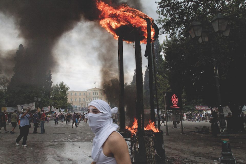 6/29/2011, Athens, Greece. Syntagma Square. The main square in Athens. Rioters burnt a advertising platform. The protests in Syntagma had been already going on for months.