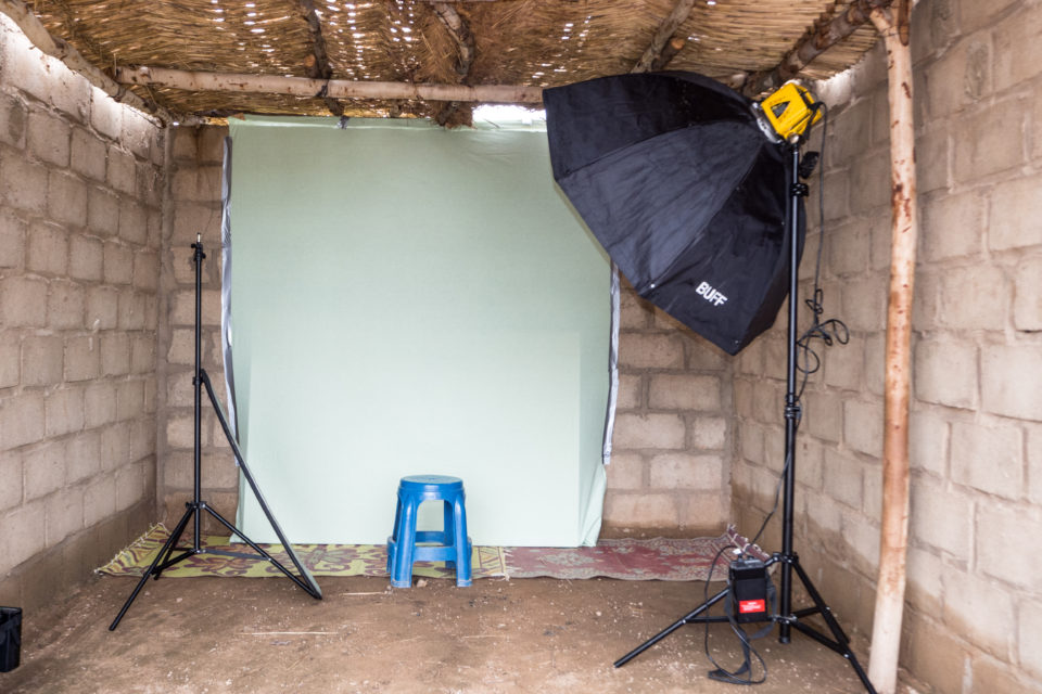 Pop-up photo studio in the shelter centre where the photos of the children are taken. 