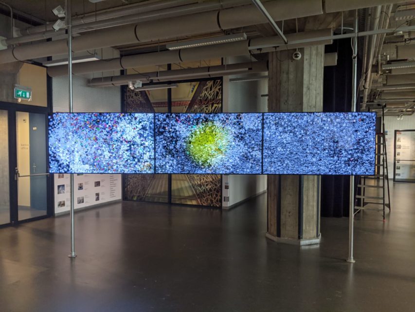 Three screen installation in the Collection Illuminated by...Artificial Intelligence